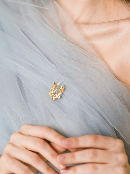 Брошка «Квітучий тризуб»